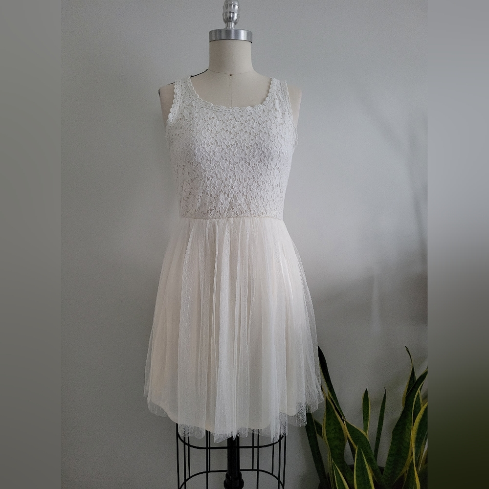 Lace and tulle dress with heart-shaped cut out on back